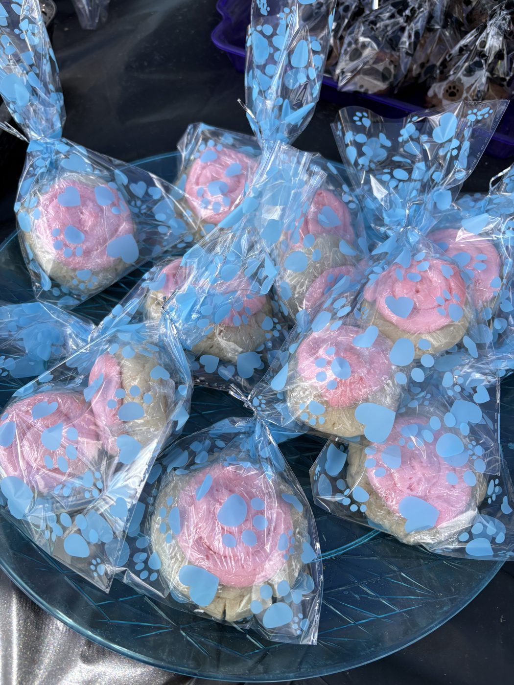 Pink frosted cookies at a S’more Dogs bake sale
