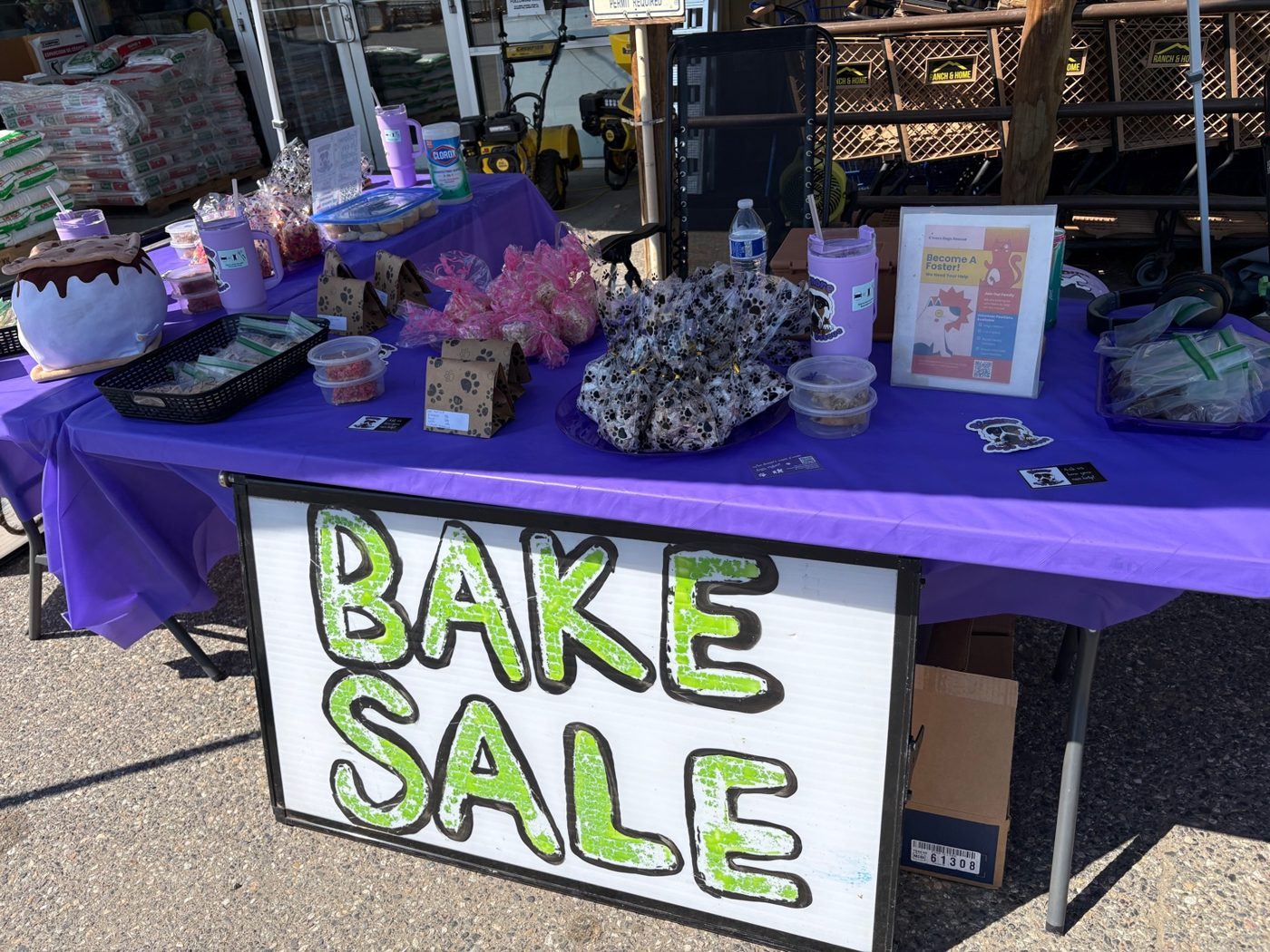 S’more Dogs Rescue bake sale table and handmade sign
